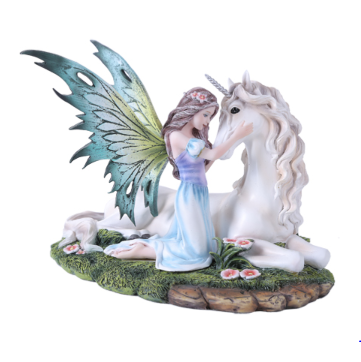 Fairy and Unicorn Figurine with teal wings in meadow setting